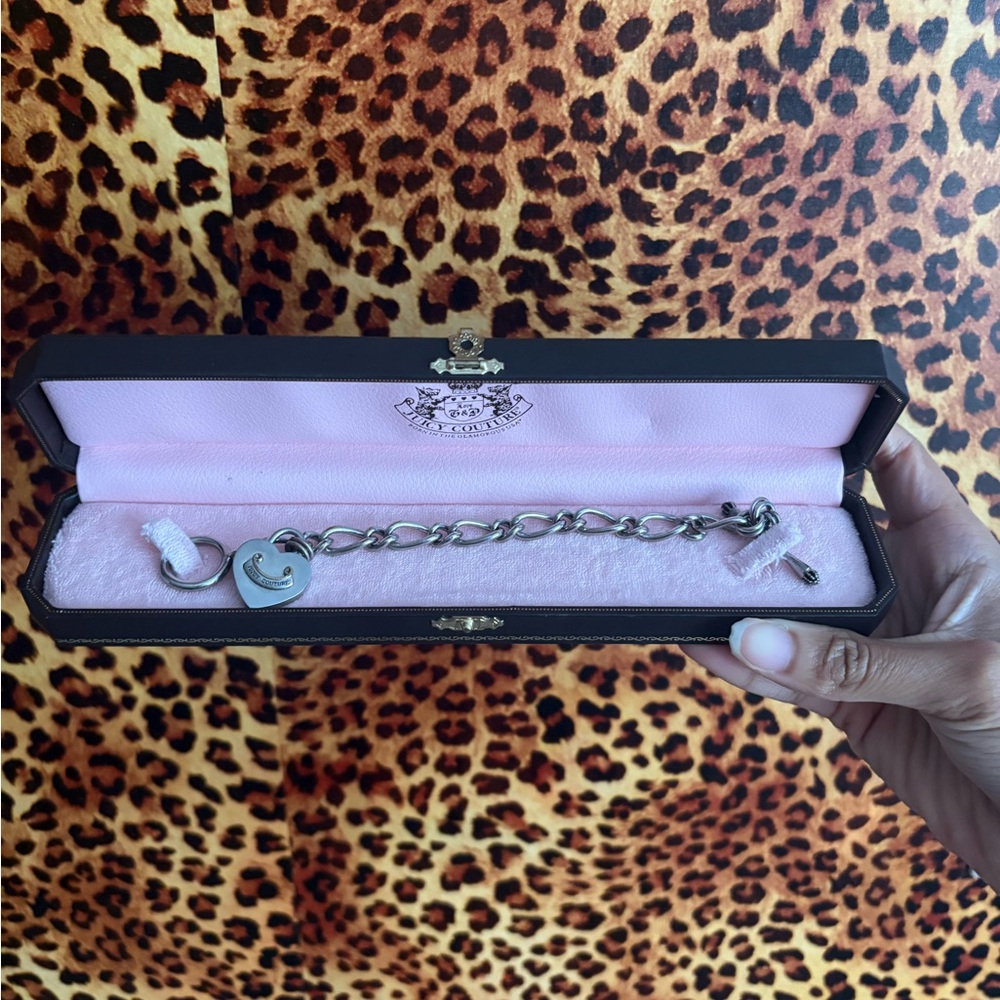 Silver juicy couture Charm Bracelet comes with one charm!!